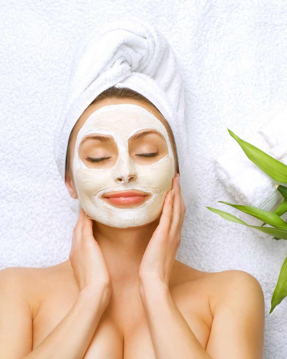 Spa Woman Applying Facial Cleansing Mask